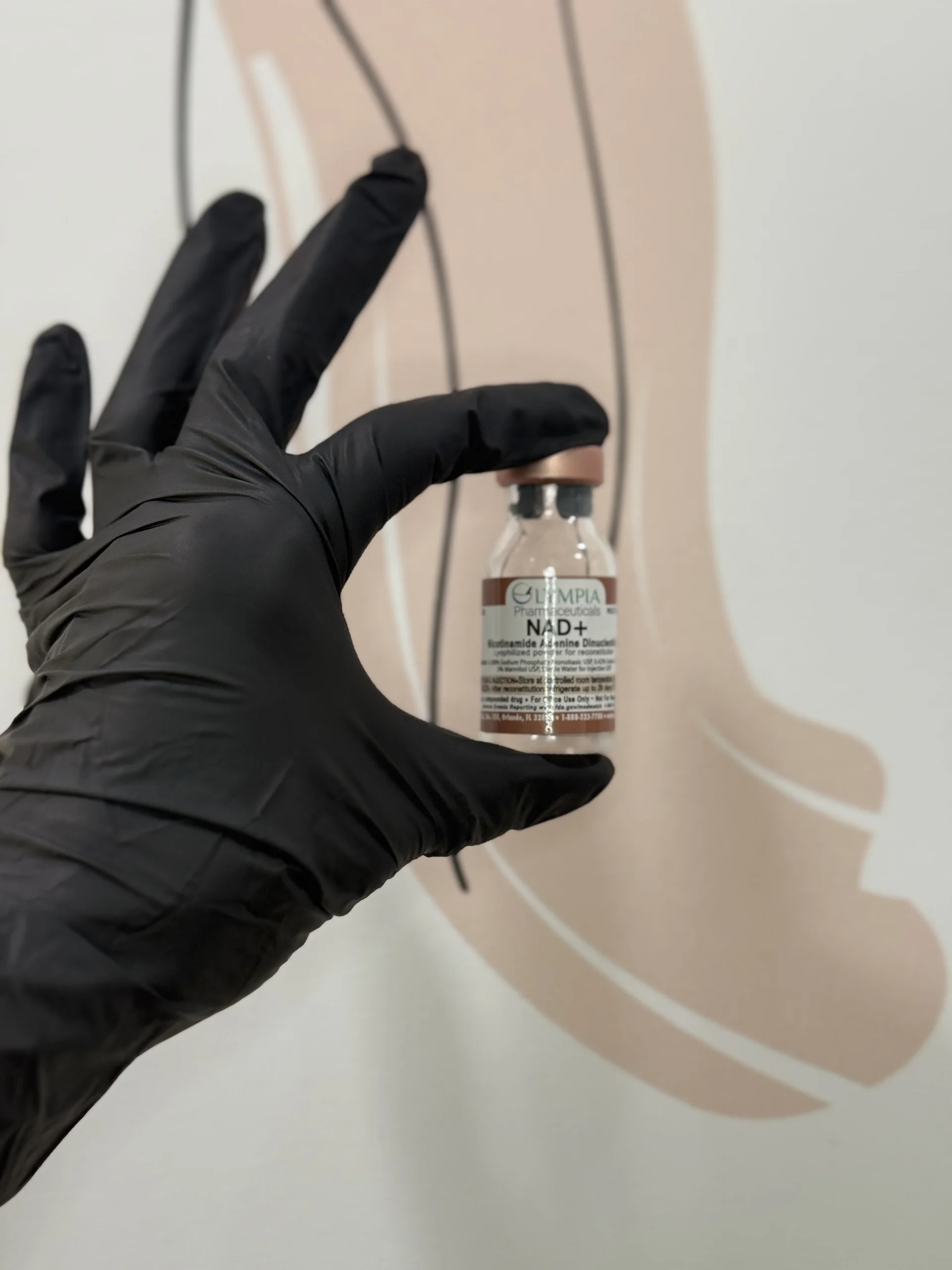 Peptide therapy vial held by clinician